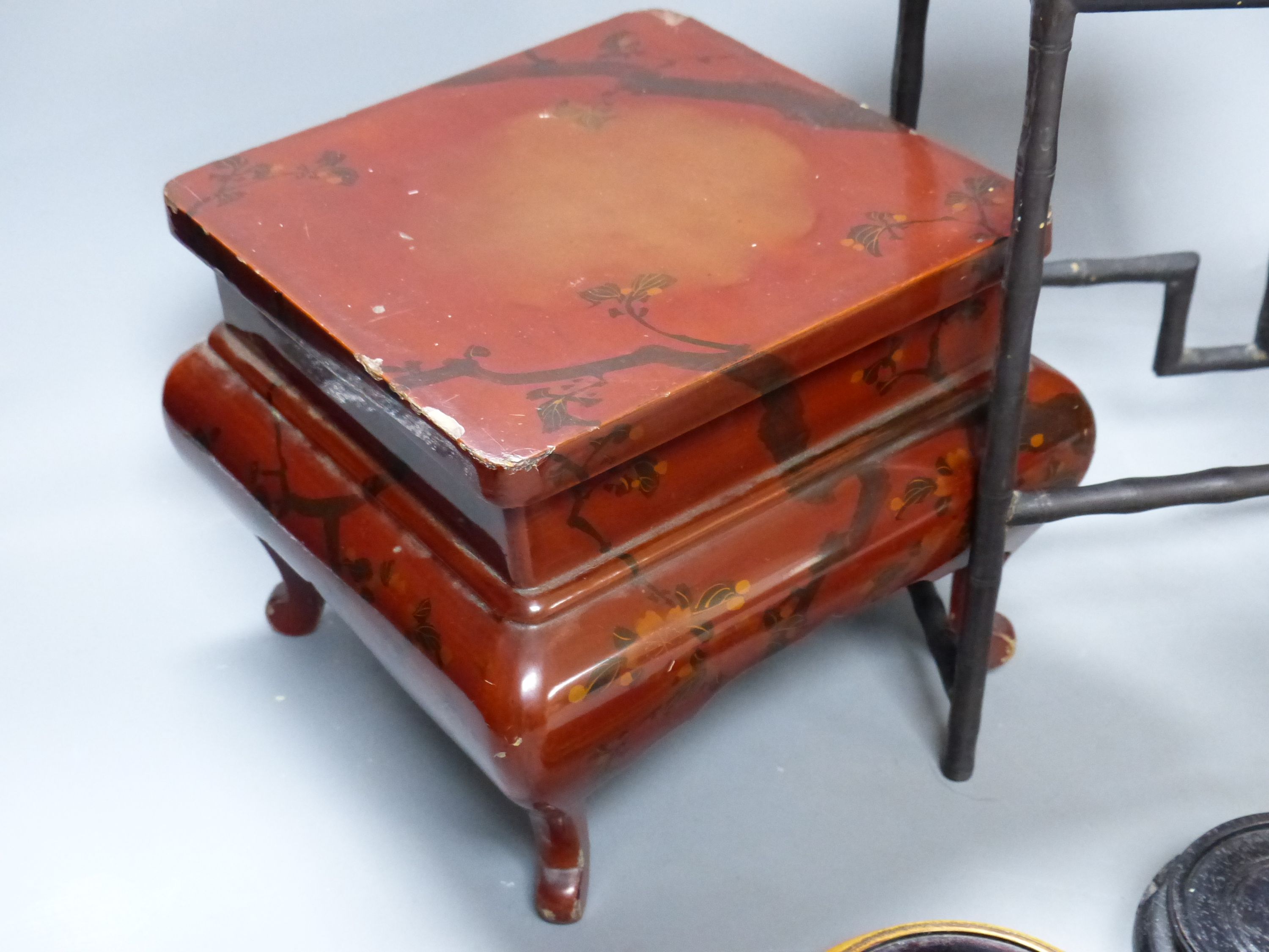 A group of Chinese wooden and bronze stands, tallest 15cm